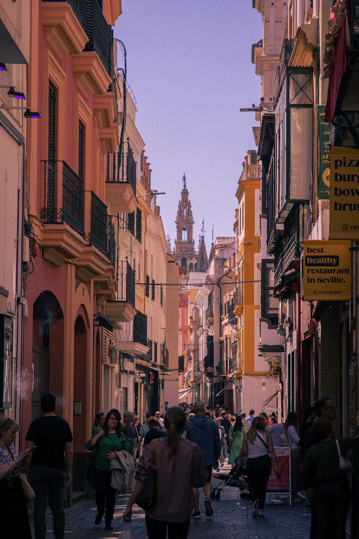 A bustling Seville alleyway.